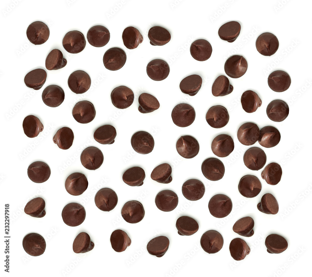 Obraz premium Scattered chocolate chips morsels or drops from top view isolated on white background