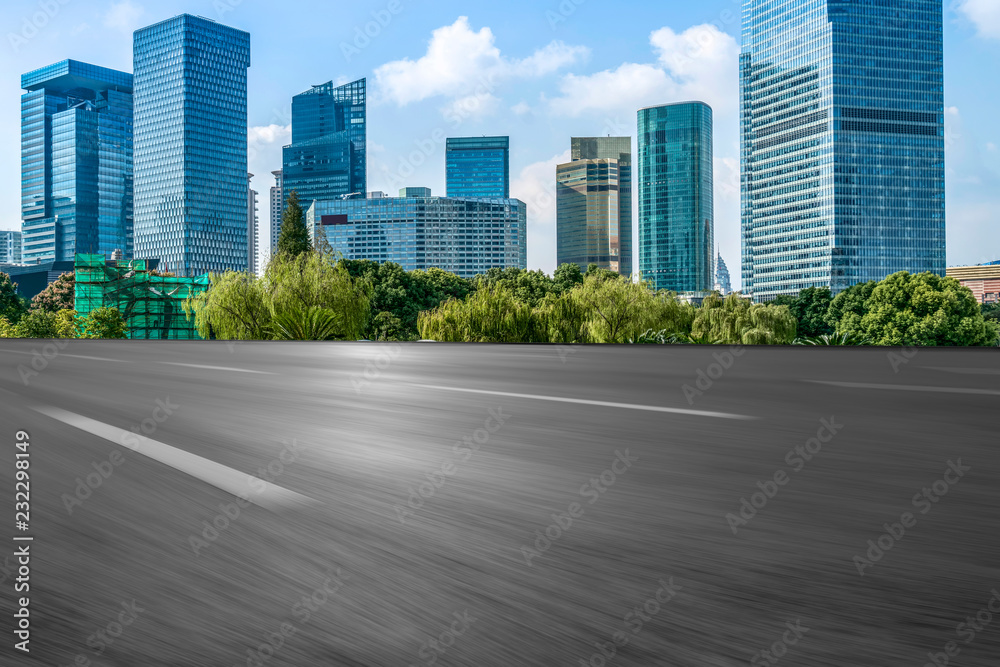 Empty asphalt road along modern commercial buildings in China's cities Empty asphalt road along modern commercial buildings in China's cities