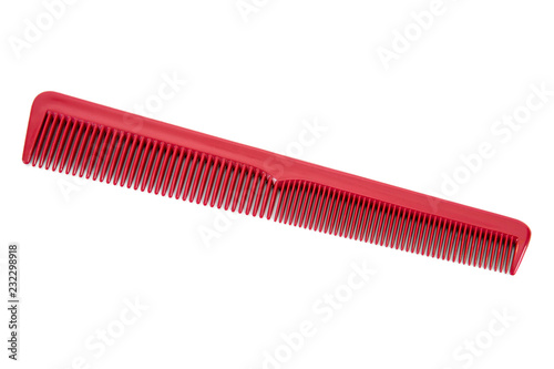 Barber hair comb isolated on white background.Red long hairbrush isolated