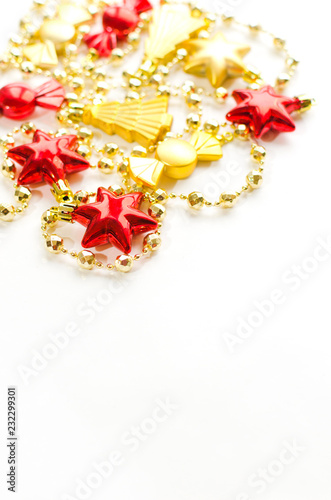 Christmas decoration isolated on white. Red and golden stars, candies, christmas trees.