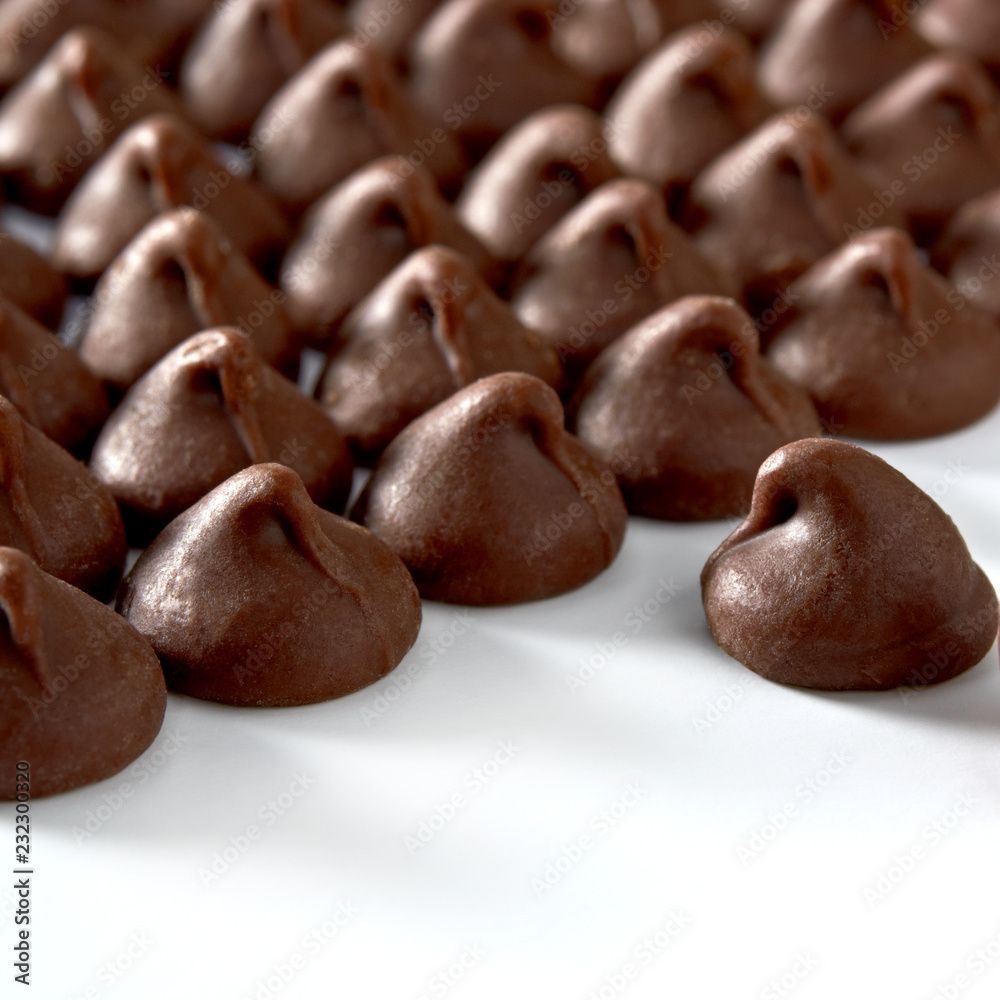 Chocolate drops or chocolate chips from top view isolated on white background Chocolate drops or chocolate chips from top view isolated on white background