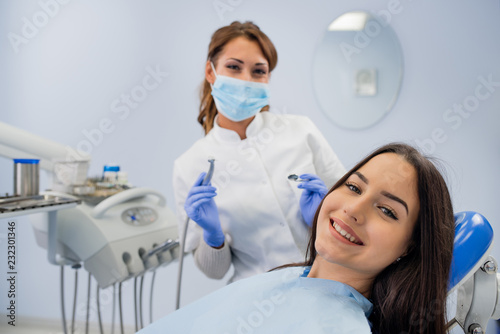 Happy girl smiling at the dentist
