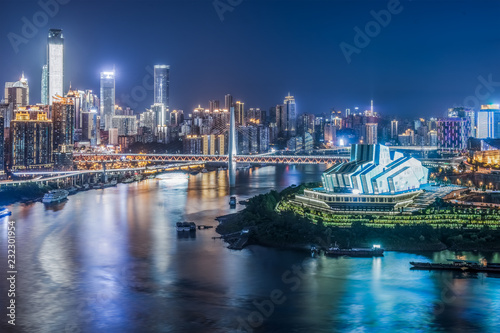 cityscape and skyline of downtown near water of chongqing at night © yuqiu