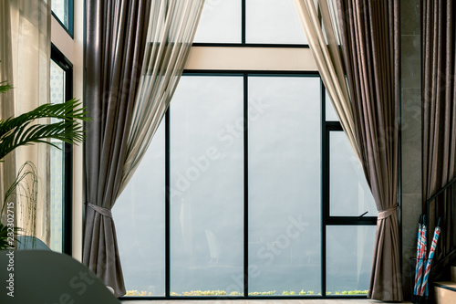curtain in loving room  interior design and decoration at home with light and glass window behind
