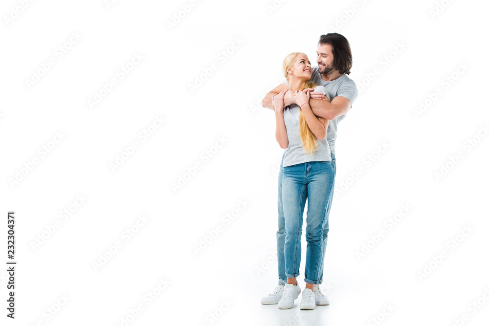 Romantic couple hugging and looking at each other isolated on white Romantic couple hugging and looking at each other isolated on white