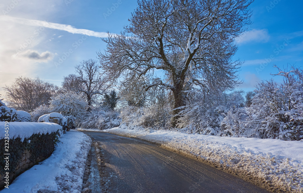 Narrow road with melting snow