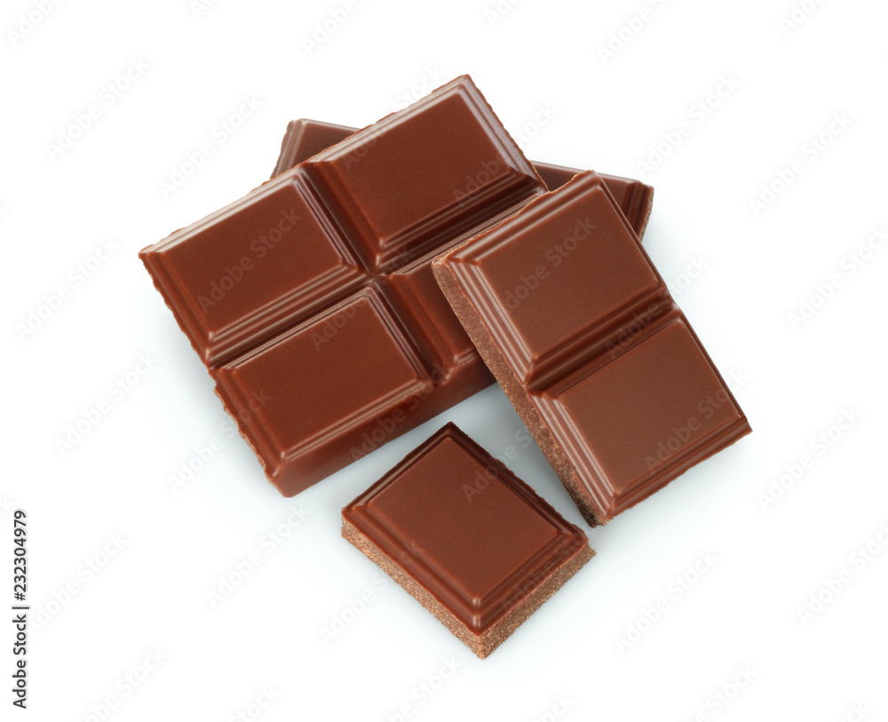 Milk chocolate pieces on white background Milk chocolate pieces on white background