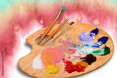 Wooden art palette with blobs of paint