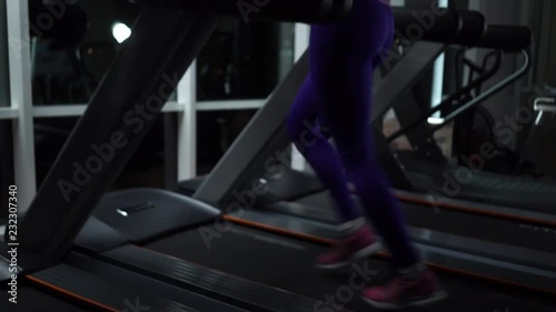 women legs on the treadmill photo