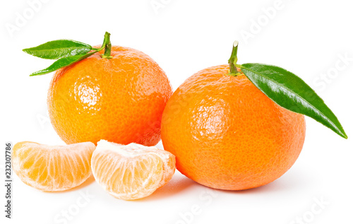 Tangerine or clementine with green leaf and slices isolated on white