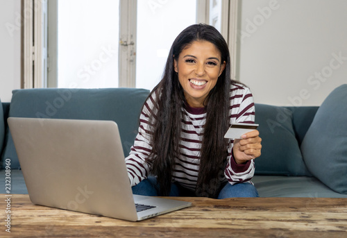 Happy Woman shopping online with credit card and laptop in internet shopping © SB Arts Media