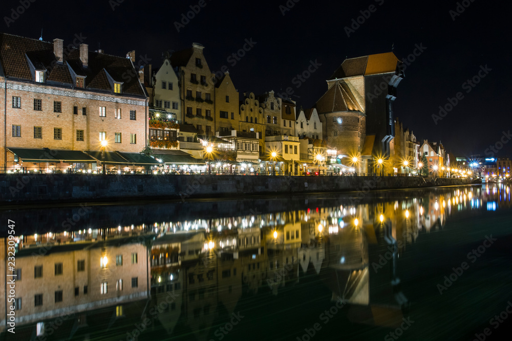 Ancient houses on the promenade of Gdansk at night. Poland