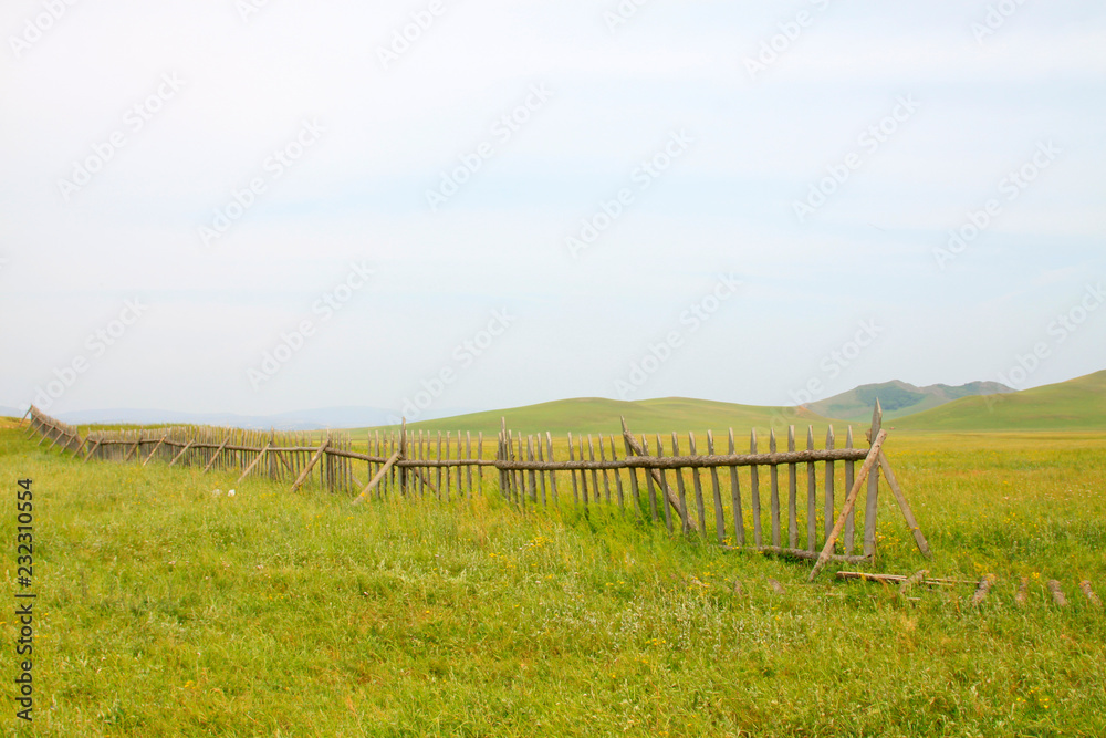 wooden fence in the WuLanBuTong grassland, China