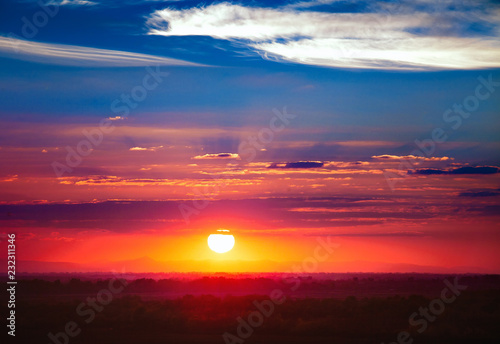 Fototapeta Naklejka Na Ścianę i Meble -  Dramatic sunset sky with sun and spindrift clouds