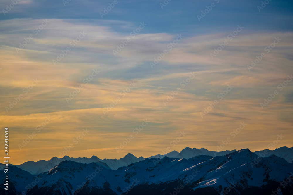 Sunset over Snow covered Mountains