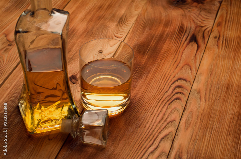 Glasses for whiskey on a wooden table Glasses for whiskey on a wooden table
