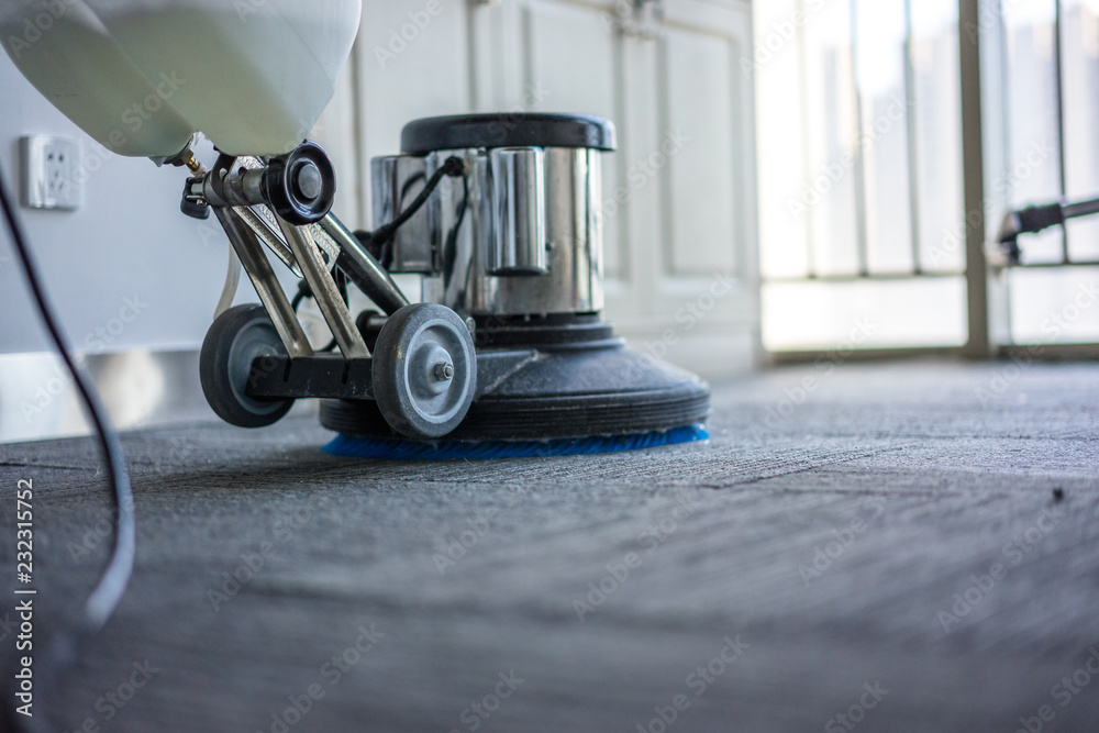 cleaning floor with machine