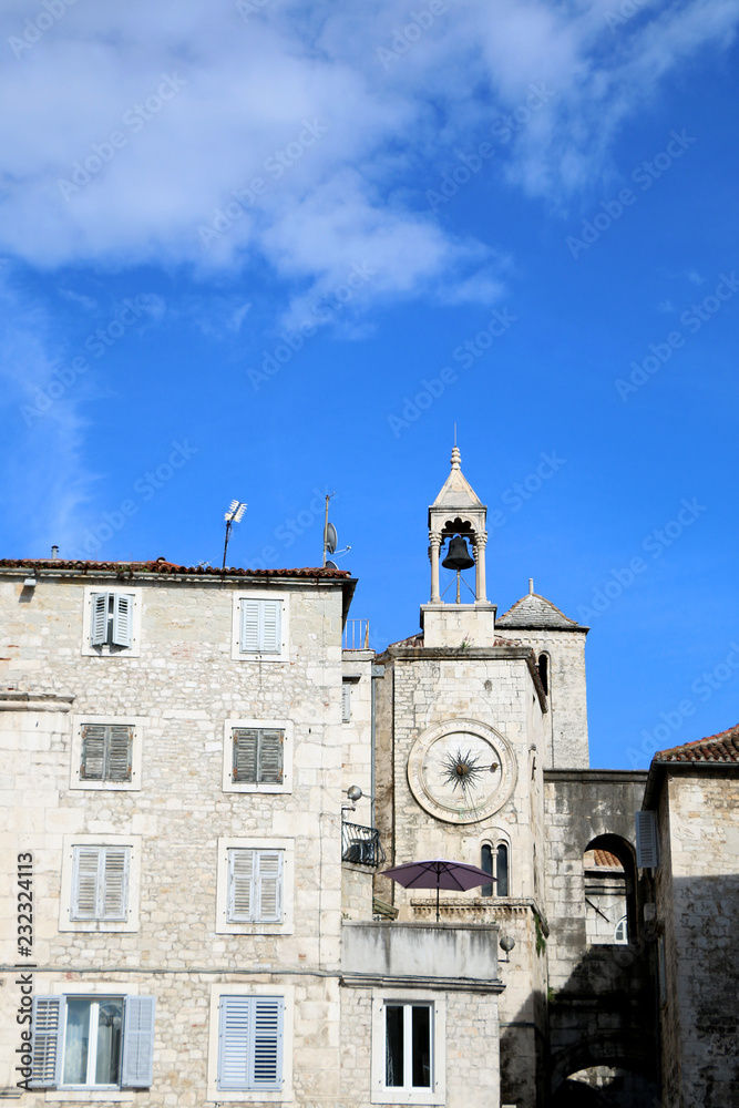 Historic buildings in Split, Croatia with landmark city clock. Split is popular coastal travel destination.