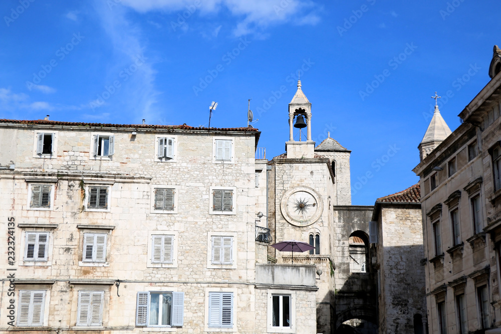 Historic buildings in Split, Croatia with landmark city clock. Split is popular coastal travel destination.