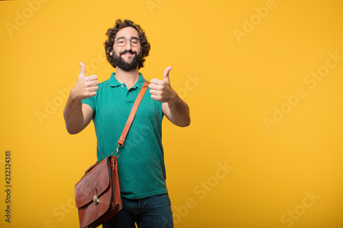 young freelancer man expresing a concept against orange isolated photo