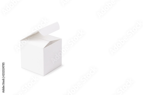A white cardboard box on a white background on th left. Box mock-up. Photo of square white box. Side view of half open box.