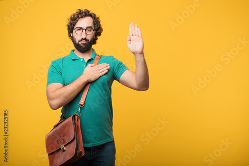 young freelancer man expresing a concept against orange isolated