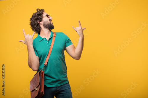 young freelancer man expresing a concept against orange isolated photo