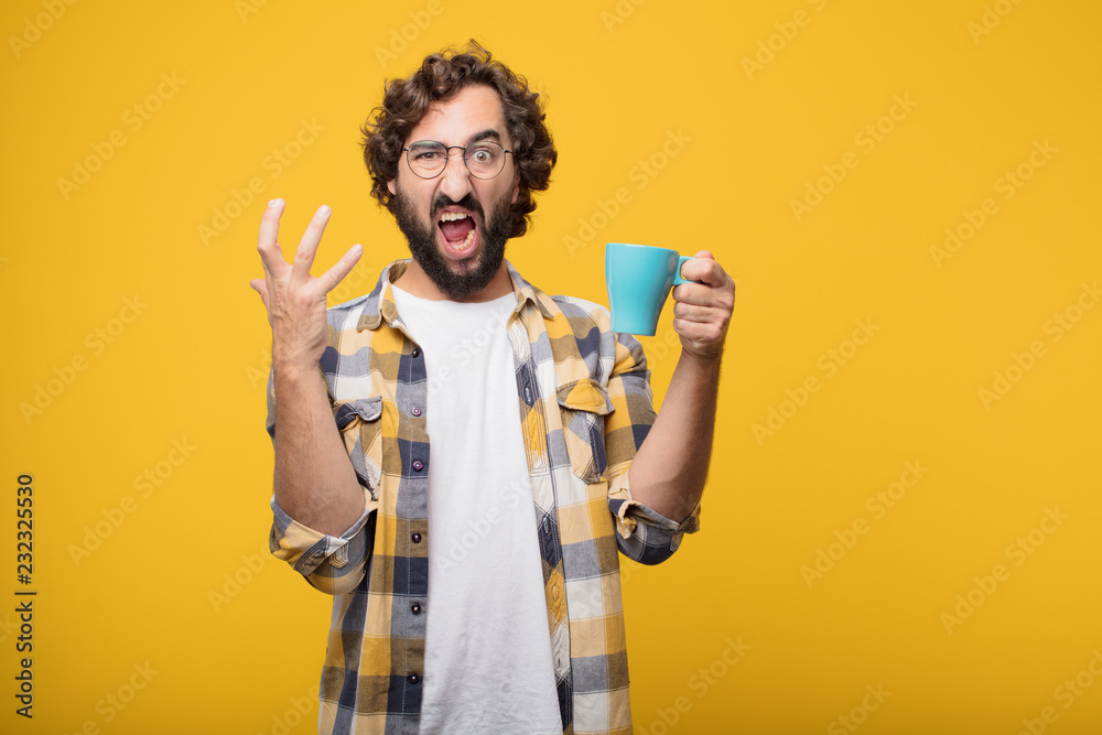 young crazy mad man  fool pose with a coffee. - obrazy, fototapety, plakaty 