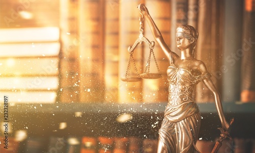 Statue of justice on library background. photo