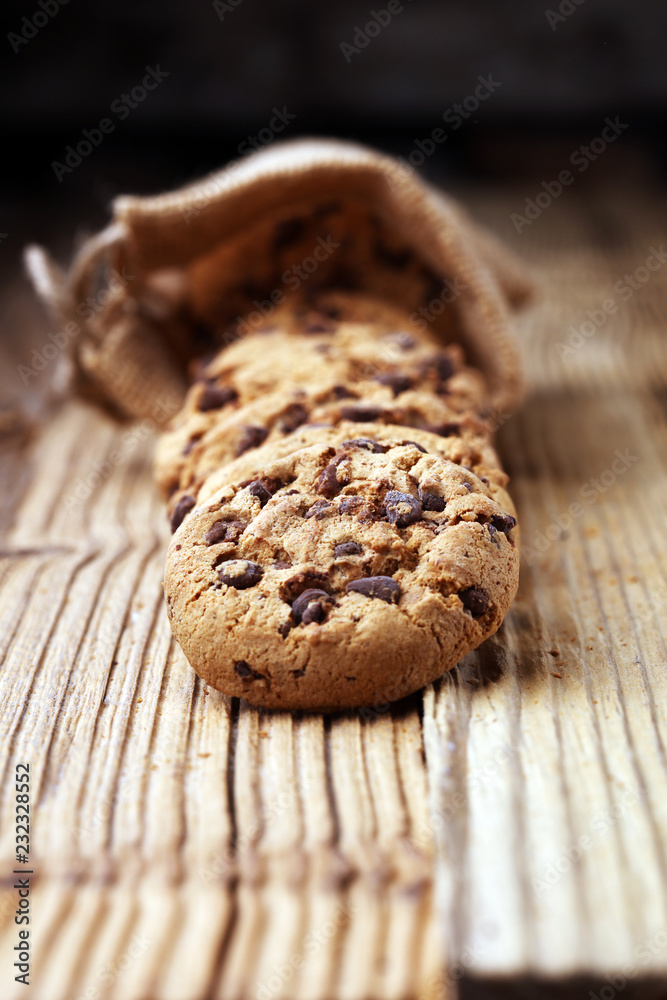 Chocolate cookies on wooden table. Chocolate chip cookies shot. Chocolate cookies on wooden table. Chocolate chip cookies shot.