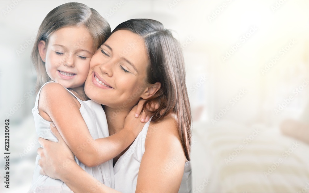 Happy Mother and daughter hugging Happy Mother and daughter hugging