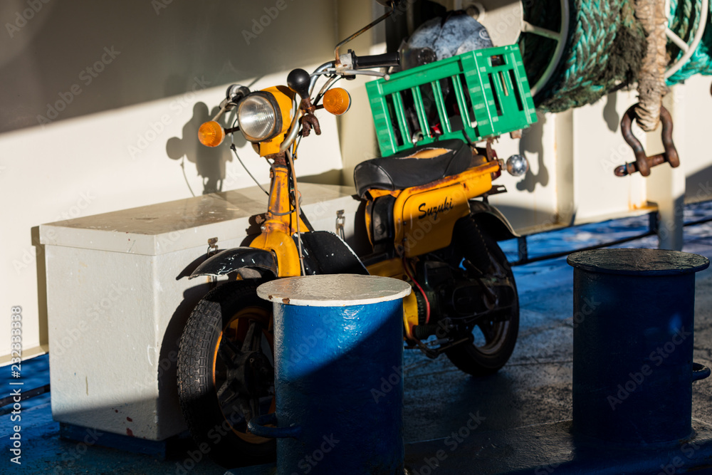 Old moped on ferry deck Old moped on ferry deck