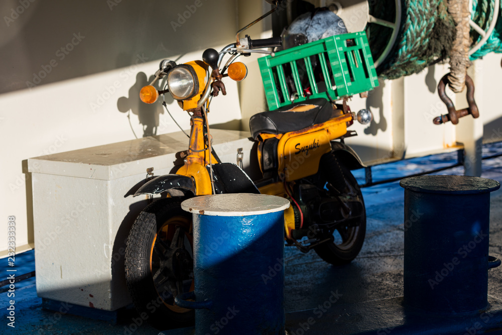 Old moped on ferry deck