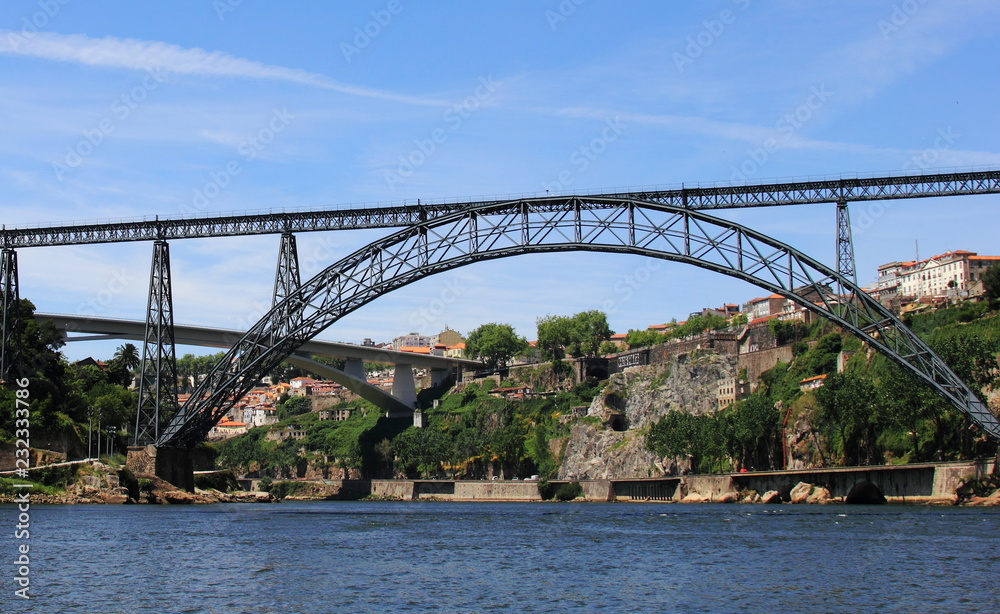 Embankment of Douro River with Bridge of Luis I and Prince Henry Bridge in Porto, Portugal