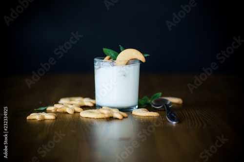 sweet homemade yogurt with cookies in a glass cup