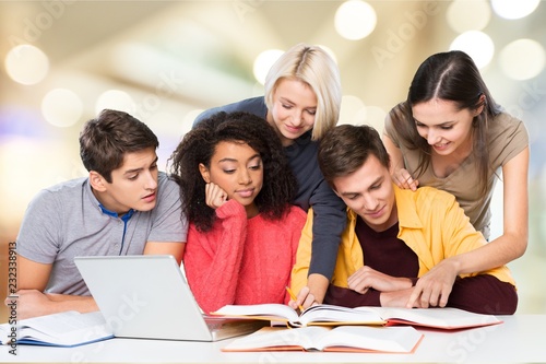 Four Young students studying subject on background