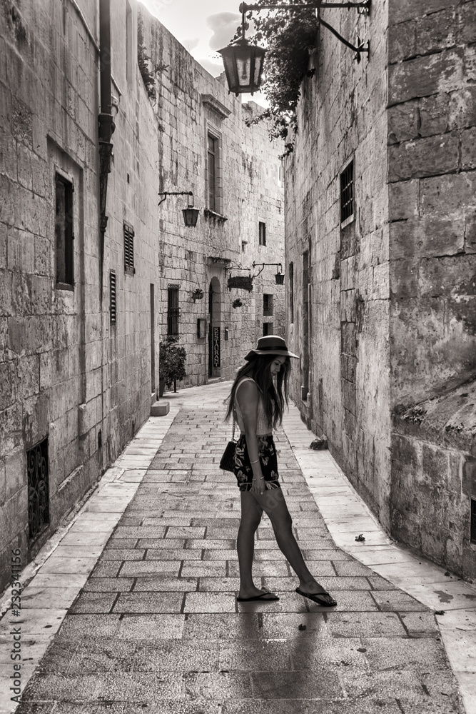 Woman on the ancient streets of Mdina, Malta