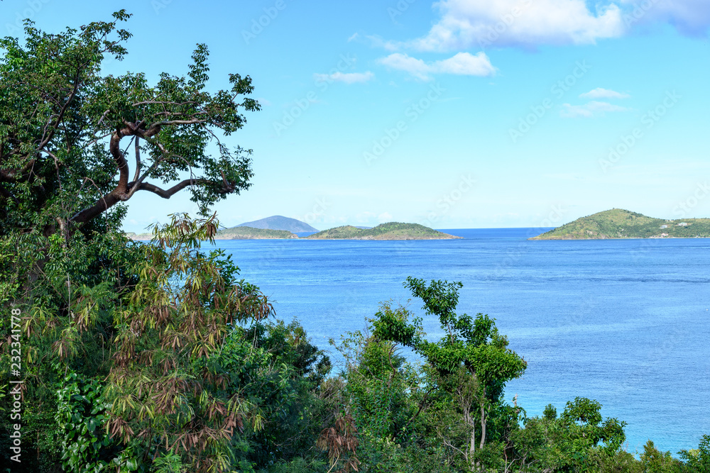Beautiful view of the sea Bay with tropical Islands on the horizon and green jungle in the foreground. Beautiful view of the sea Bay with tropical Islands on the horizon and green jungle in the foreground.