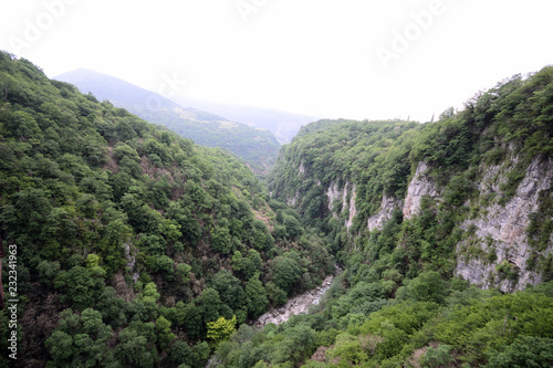 amazing green vertical rock wall of Martvili Canyon © Olga Loko