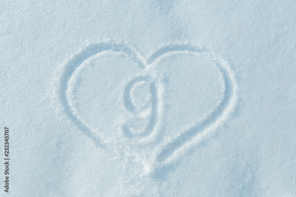 A figure of nine written in the snow in the painted heart. Snow texture.