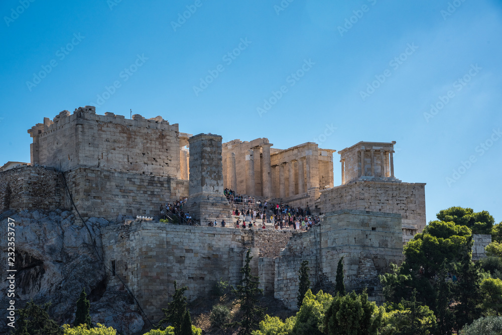 People touring Destination Hill with the Acropolis Of Athens, Part of ruins