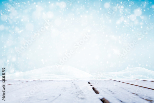 Winter background  falling snow over wooden deck 