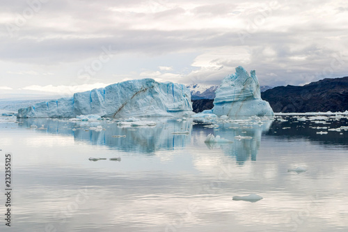 View of an iceberg reflected in the water, navigating the Upsala channel in the glacier national park, Argentina