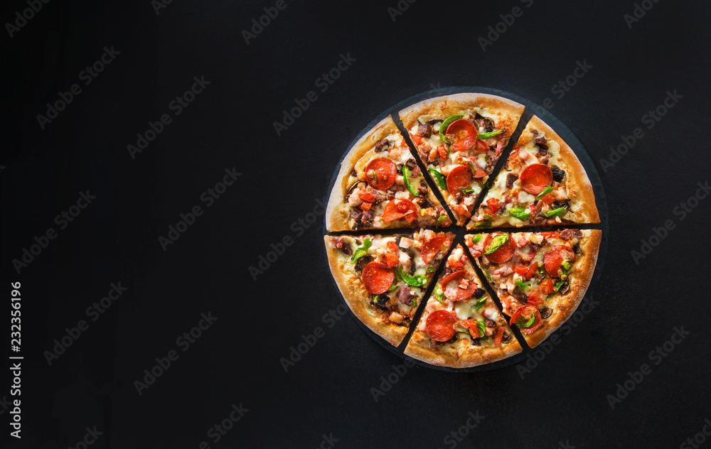 Flat lay of italian pizza on dark surface top view