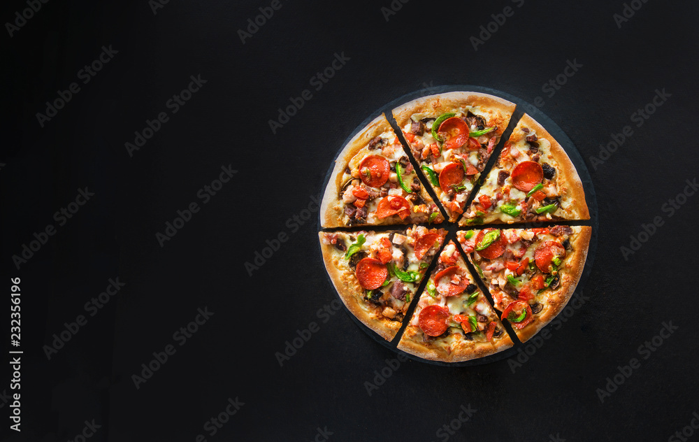 Flat lay of italian pizza on dark surface top view Flat lay of italian pizza on dark surface top view