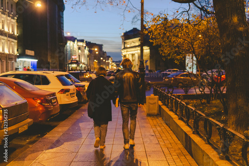 people walking on the street at night