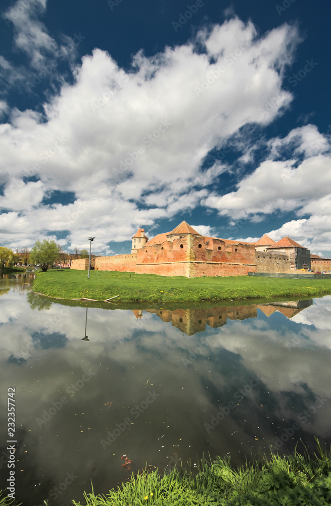 Fototapeta premium Fagaras fortress mirrored in the water