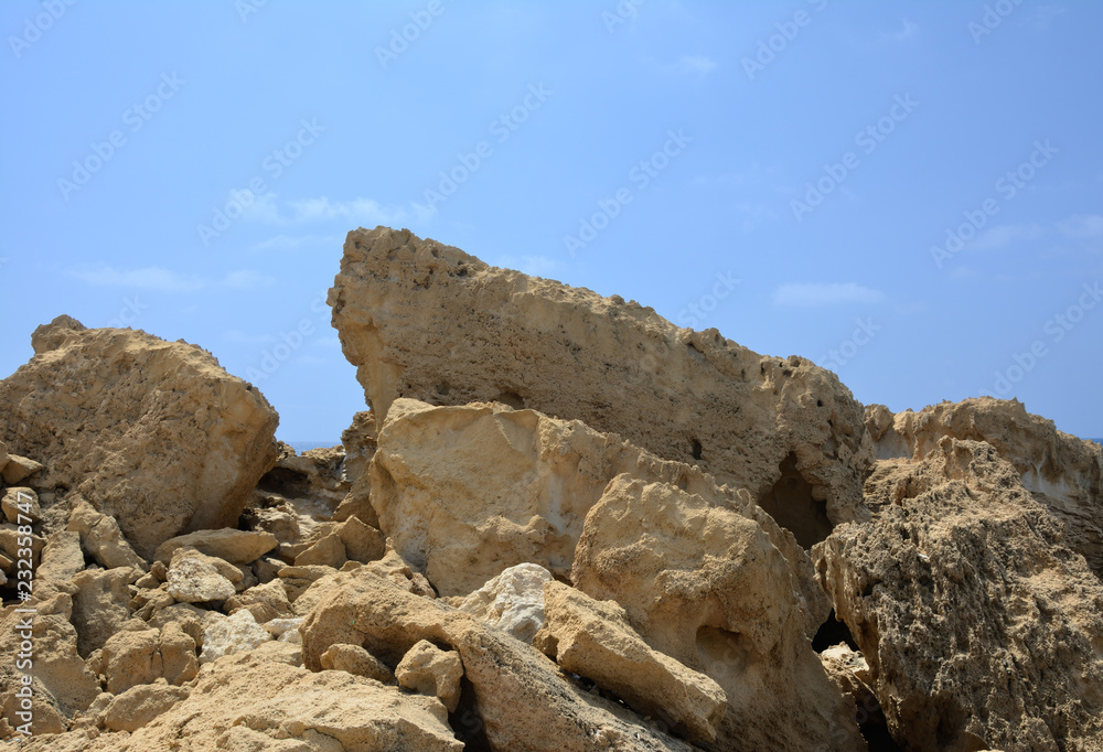 big stones and pumice against the background of the sky