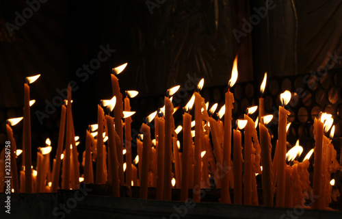Candles in the dark as symbol of faith