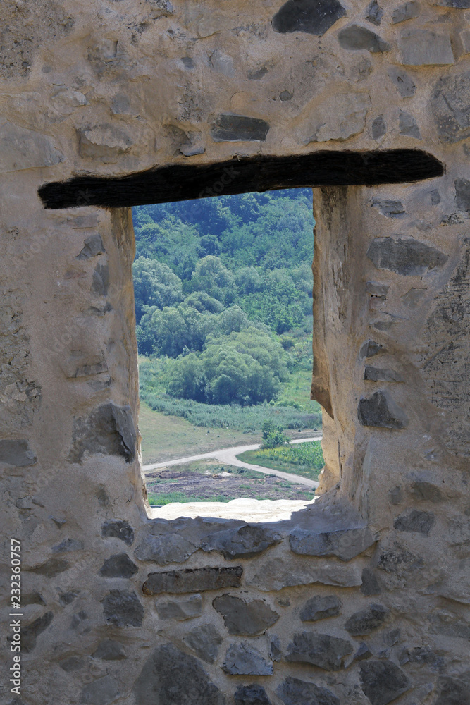 Fortress eye, landscape seen through old castle window